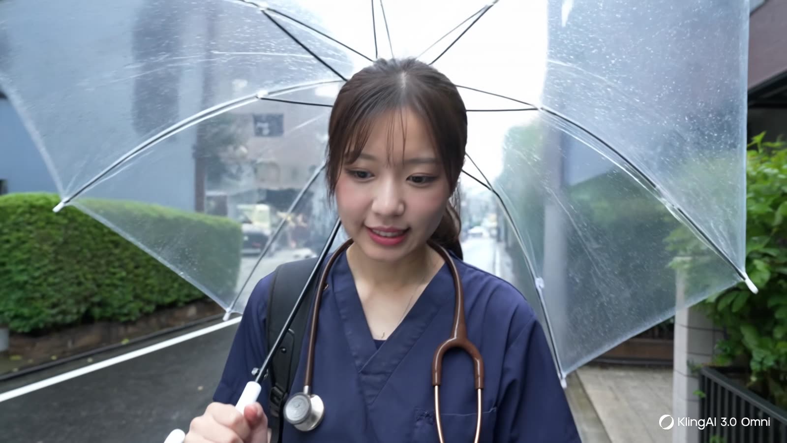 傘をさして次の訪問先へ向かう